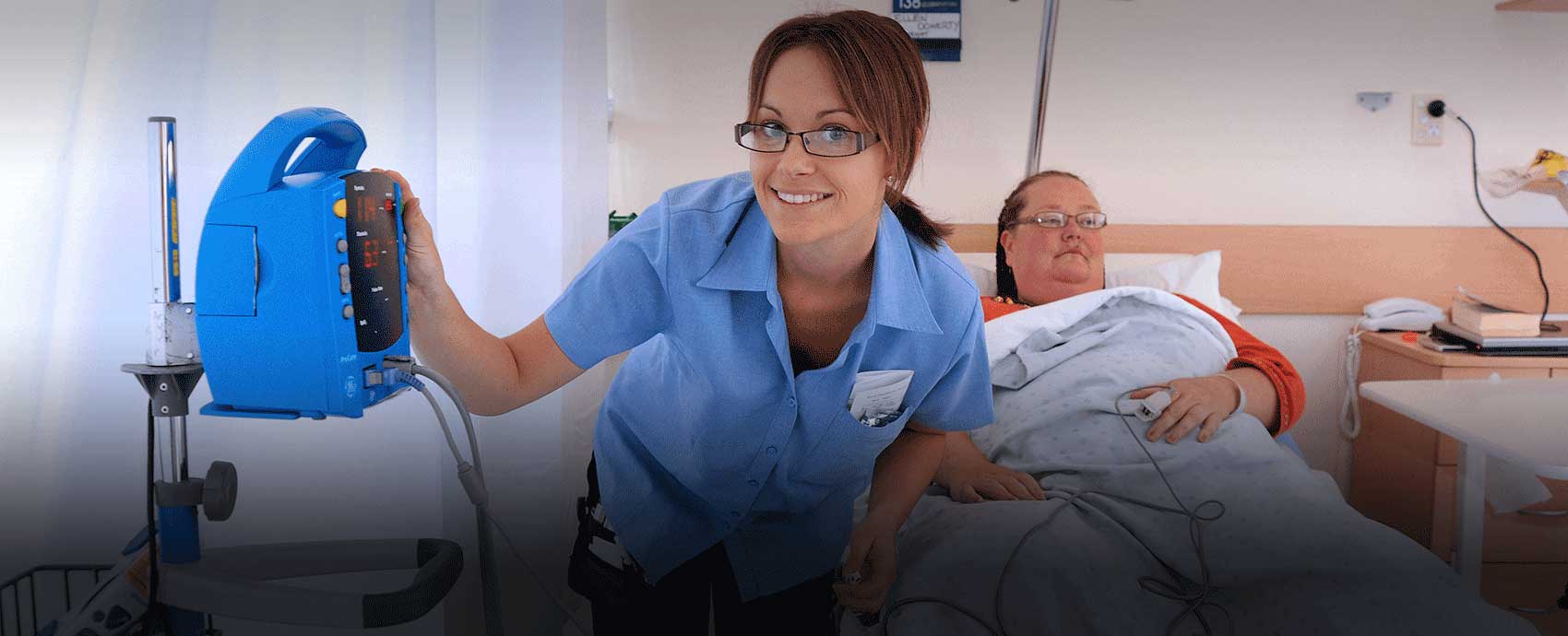Nurse with a patient in a hospital in regional Victoria